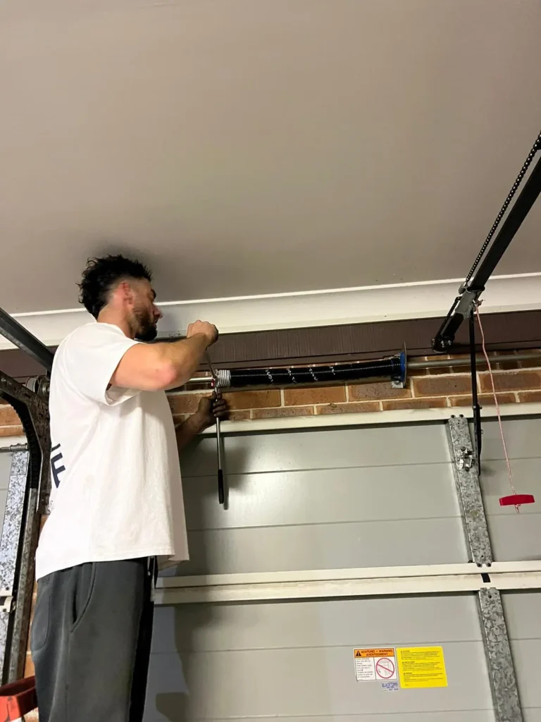 Vibe Garage Door Repair technician tension garage door spring